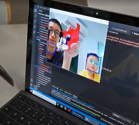 Ender and Edison on a laptop screen running a face-tracking program