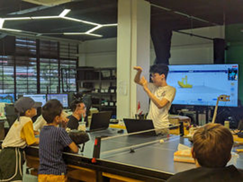 Students building and testing their projects at a NextBuilder maker class