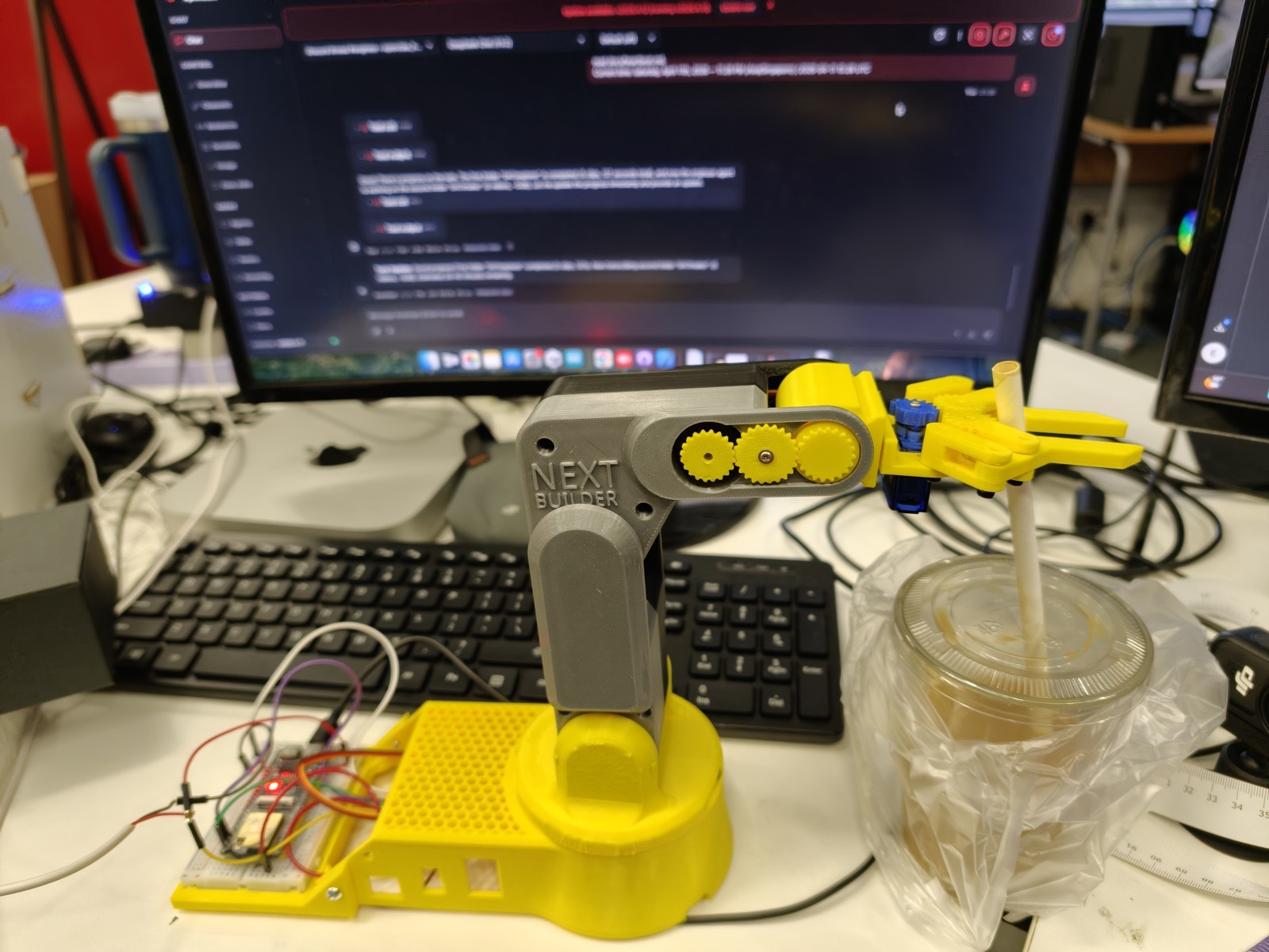 Students building and testing their own robot hardware at a NextBuilder maker class