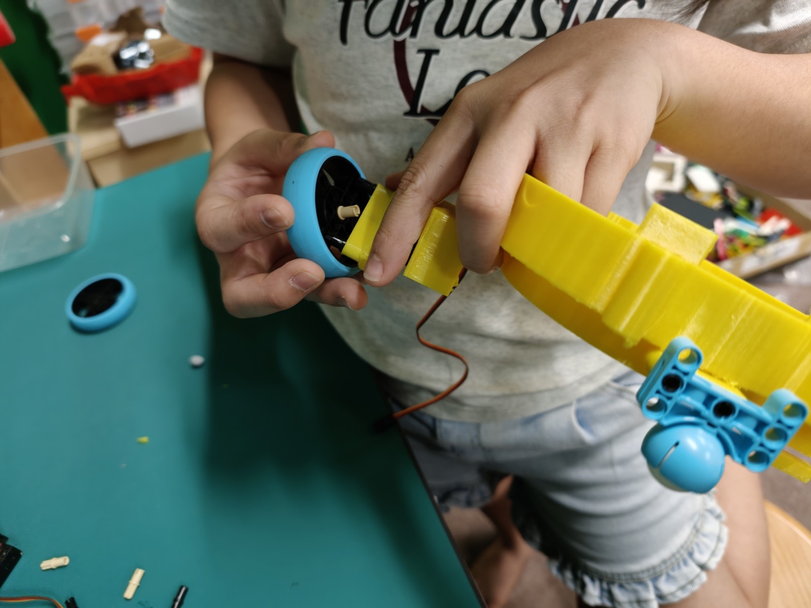 Students building and testing their projects at a NextBuilder maker class